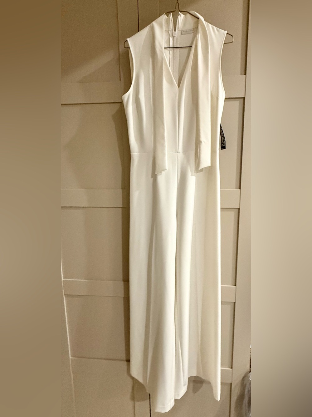 Sleeveless White V-Neck Jumpsuit with Neck Tie